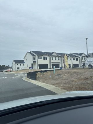 Street view Modern townhomes with sleek designs in Azalea Square Townhomes by Century Communities, Lawrenceville, GA.