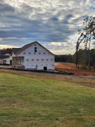 An under-construction home with scenic views in Riverside by RiverWILD Homes, Zebulon, NC.