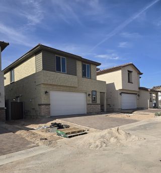 Stylish modern homes with clean lines and spacious garages in Avanti at Granite Vista by Elliott Homes (Waddell, AZ).