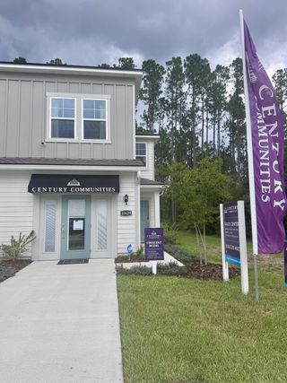A modern model home with sleek siding in The Villas at Bishop Oaks by Century Communities (Jacksonville, FL).