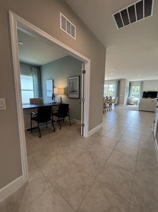 A modern, open-concept home with a spacious and elegant design. The home features a seamless flow between the kitchen, dining, and living areas, creating a bright and airy atmosphere. 