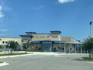 Modern educational facility with blue accents in Woodland Park by Providence Homes, Ponte Vedra Beach, FL.
