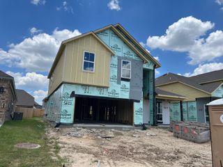 A contemporary home under construction in Champions Oak by Long Lake Ltd., featuring modern design elements (Houston, TX).