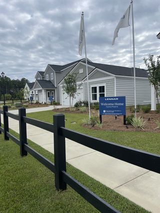 Charming community entrance with landscaped yards in Cypress Preserve: American Dream Series by Lennar (Moncks Corner, SC).