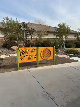 A playful community area with interactive games in Sierra at Alamar by David Weekley Homes (Avondale, AZ).
