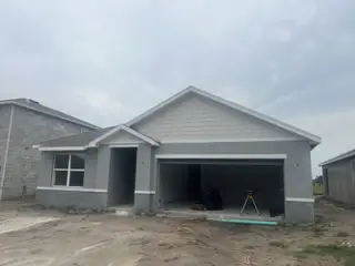 A spacious two-story home under construction with a two-car garage in Mirada by D.R. Horton (San Antonio, FL).