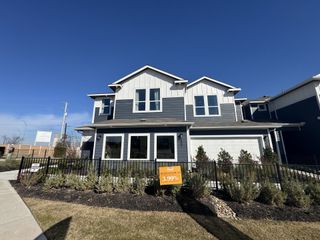 Street view Charming two-story home with modern design and landscaped yard in Center 45 by Pacesetter Homes (Round Rock, TX).