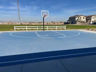 A modern basketball court with nearby homes in Mandarin at Citrus Park by Landsea Homes (Goodyear, AZ).