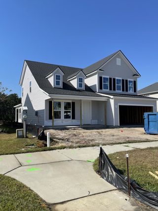 A contemporary two-story home with a spacious layout in Jasmine Point at Lakes of Cane Bay by Beazer Homes (Summerville, SC).