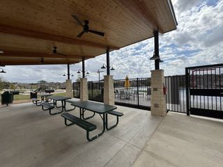 Community Amenities A covered picnic area with ceiling fans and scenic views, ideal for gatherings and outdoor enjoyment.