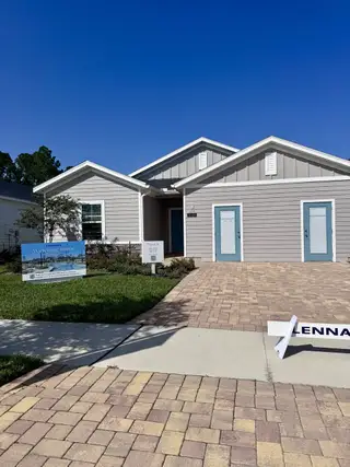 A charming modern home with a stone driveway in Edenbrooke at Hyland Trail by Lennar, Green Cove Springs, FL.