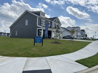 Street view Charming dark gray home with a spacious lawn in Elizabeth Springs by ExperienceOne Homes, LLC (Wake Forest, NC).