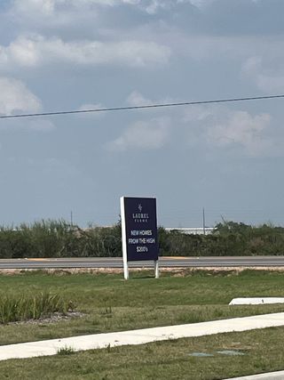 Street view A developing landscape with future homes in Vanbrooke by Century Communities, Fulshear, TX.