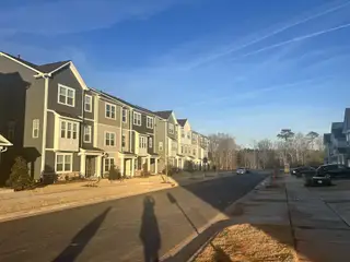 Charming modern townhomes line a quiet street in Carolina Springs: Capitol Collection by Lennar, Apex, NC.