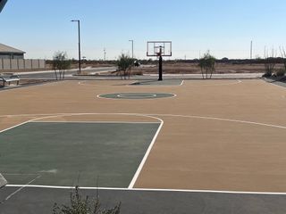Community Amenities A modern basketball court in Maple at North Copper Canyon by Courtland Communities, Surprise, AZ, perfect for outdoor activities.