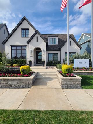 A charming modern home with manicured landscaping in Fields 50' by Britton Homes, Frisco, TX.