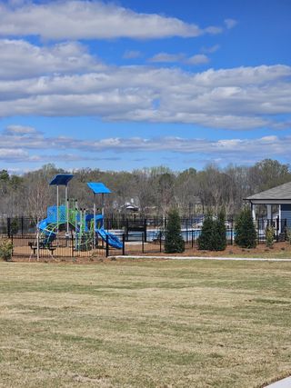 A vibrant playground and pool in Preserve at Mountain Creek by Meritage Homes in Pendergrass, GA.