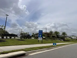 Scenic community entrance with lush landscaping in Ridgeview by Landsea Homes (Clermont, FL).