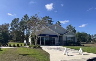 A charming single-story home with a manicured lawn in Lake Diamond by D.R. Horton, located in Ocala, FL.