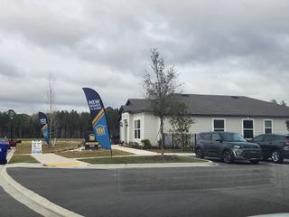 Street view Modern home with sleek design and ample parking in Westport Landing by LGI Homes, nestled in Jacksonville, FL.