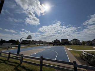 Enjoy a full-sized basketball court in Durango Farms, perfect for recreation in a beautifully maintained neighborhood setting.