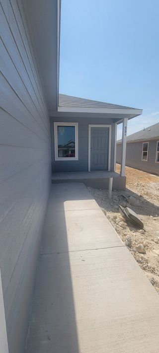 Street view A charming gray home with a welcoming porch in Landon Ridge by Lennar (San Antonio, TX).