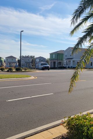 Modern homes under blue skies in Hamlin Pointe by Dream Finders Homes, Winter Garden, FL.