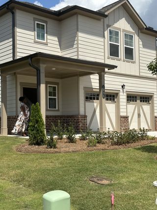 A charming two-story home with elegant brick accents in Millers Pointe by Lennar (Conyers, GA).