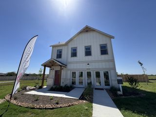 Street view A charming two-story home with modern design in Blue Ridge Ranch by Rosehaven Homes (San Antonio, TX).