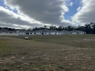 A row of modern homes with expansive yards in Autumn Glen by D.R. Horton, Belleview, FL.