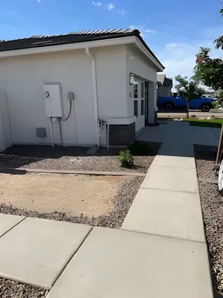 A modern home with clean lines and landscaping in Trouvaille by D.R. Horton, Phoenix, AZ.