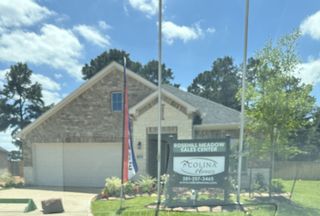 Stylish brick home with a landscaped yard in Rosehill Meadow by Colina Homes, Tomball, TX.