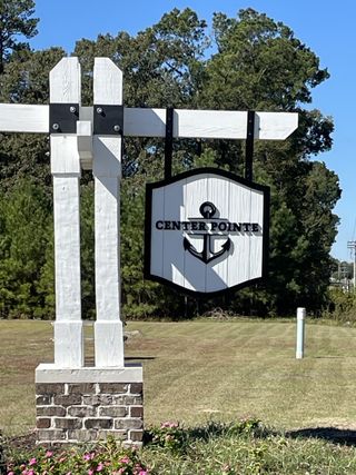 A welcoming sign in Center Pointe by D.R. Horton, surrounded by a lush landscape in scenic Santee, SC.