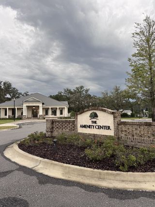 An inviting amenity center with lush landscaping in TrailMark by Dream Finders Homes (St. Augustine, FL).