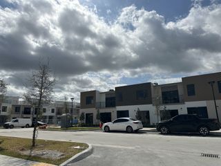 Street view Modern homes with sleek designs and flat rooftops in On Grandville by Onx Homes (Homestead, FL).