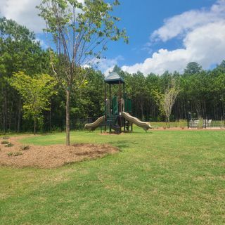 Community Amenities A family-friendly playground amid greenery in Sandtown Falls by Rockhaven Homes, Atlanta, GA.