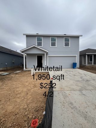 Street view A modern gray two-story home with a clean facade in the Brookmill: Brookstone II Collection by Lennar (San Antonio, TX).