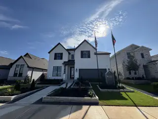 Street view A beautiful white brick home with a sleek design in Nolina - 60' by Westin Homes (Georgetown, TX).