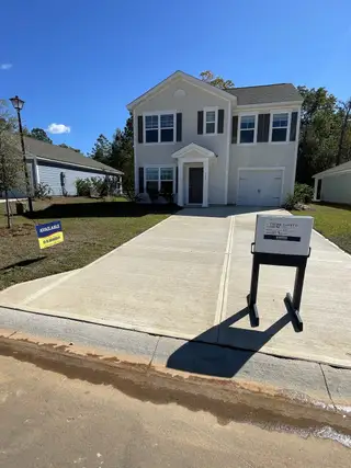 Charming two-story home with classic shutters in Center Pointe by D.R. Horton, Santee, SC.
