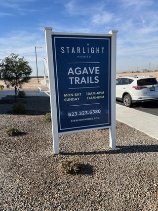 Street view Welcome to Agave Trails by Starlight Homes in Buckeye, AZ, where modern living meets desert charm.