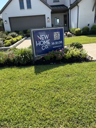 A charming home with lush landscaping and modern features in Marvida by New Home Co. (Cypress, TX).