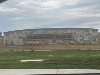 Earnhardt Ranch by Blandford Homes in Chandler, AZ showcases a welcoming stone entryway with manicured landscaping.