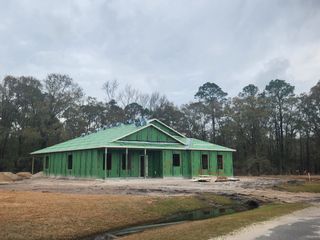 A new construction home with a green sheathing in Creekside Landing by Maronda Homes (Callahan, FL).