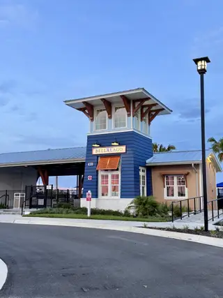 A charming blue building with a modern design in Lakes at Bella Lago - Signature Series by Meritage Homes (Green Cove Springs, FL).