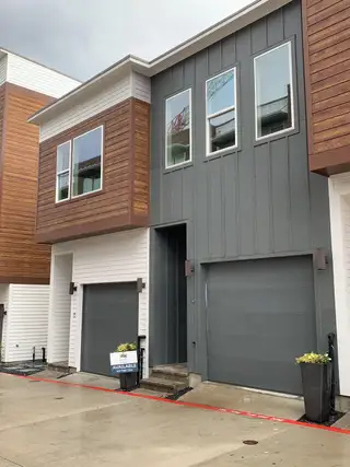 Street view Contemporary townhouse with mixed siding and sleek design in Bluebonnet Lofts by InTown Homes (Austin, TX).