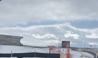A snowy landscape under a cloudy sky in Macanta: The Grand Collection by Lennar, Castle Rock, CO.