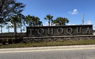 Street view A grand entrance sign welcomes residents to the master-planned Tohoqua community by Lennar in Kissimmee, FL.