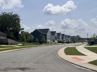 Street view Charming suburban street with modern homes and lush greenery in Eckley by Tri Pointe Homes (Mooresville, NC).