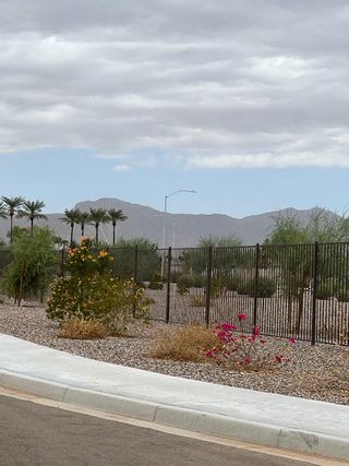 A serene desert landscape in Allen Ranches: Fiesta Collection by Taylor Morrison, featuring mountain views in Litchfield Park, AZ.