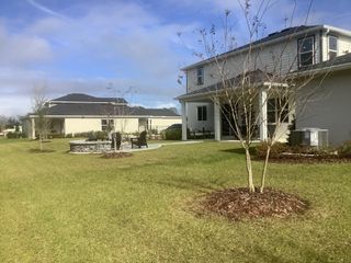 Beautiful homes with a spacious backyard and patio in Naples Village at Verona I by KB Home (Titusville, FL).
